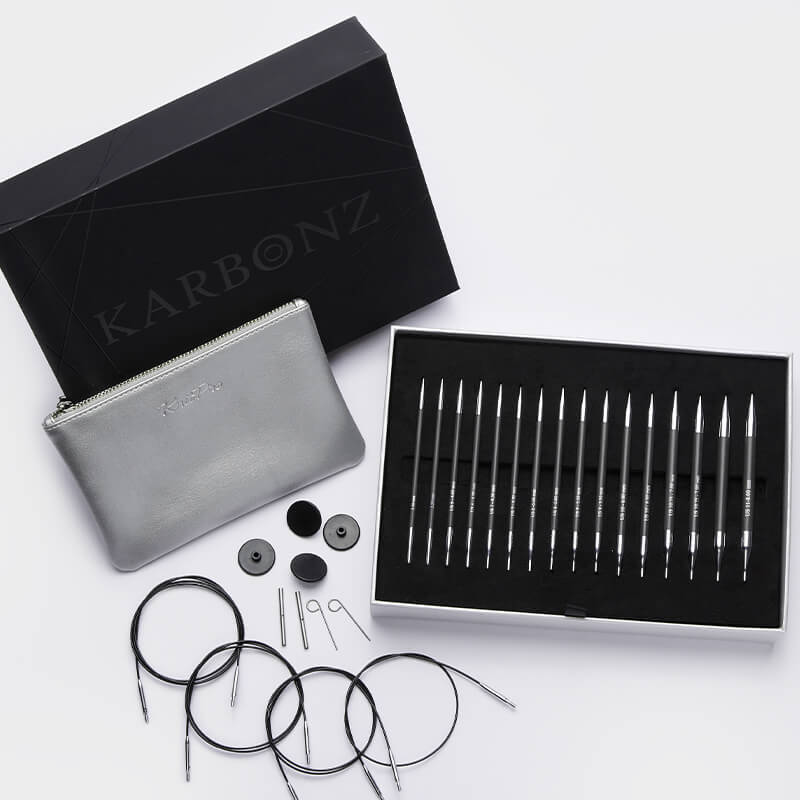 KARBONZ "BOX OF JOY" /13cm standarta garuma maināmo apļa adāmadatu komplekts ar kabeļiem /Knit Pro/ 8 izmēri